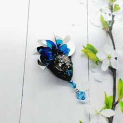 Black-blue bug and flower brooches